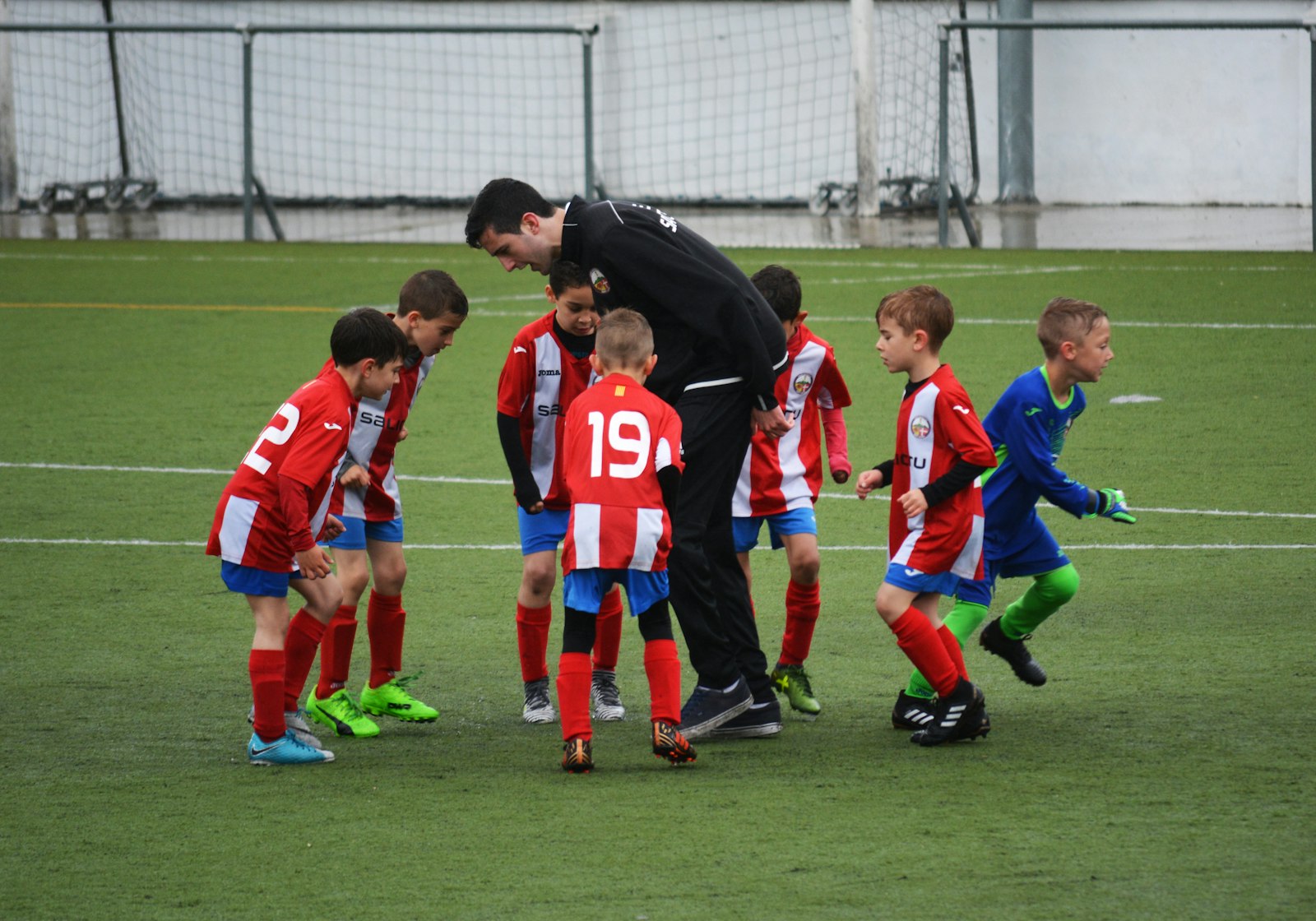 Young children playing soccer together, illustrating the Teddy Soccer toddler programme at Baseline Tennis Academy in DHA, Karachi