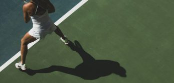 Adult tennis player practicing on court, illustrating what to expect in the first month of adult tennis classes at Baseline Tennis Academy in DHA, Karachi